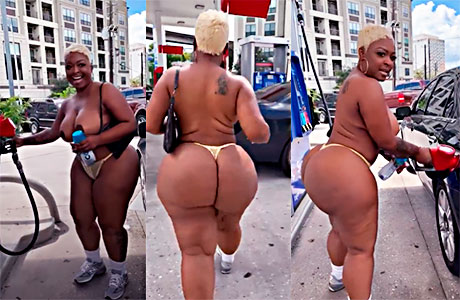 African American slut pumping gas and showing her ass and tits